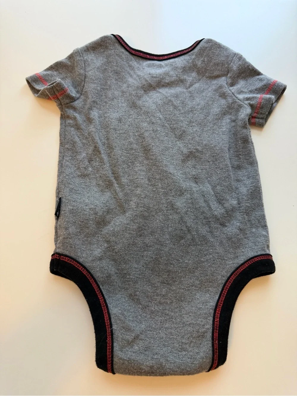 Disney Gray Mickey Mouse Graphic One-Piece with Yellow, Red and Black Accents